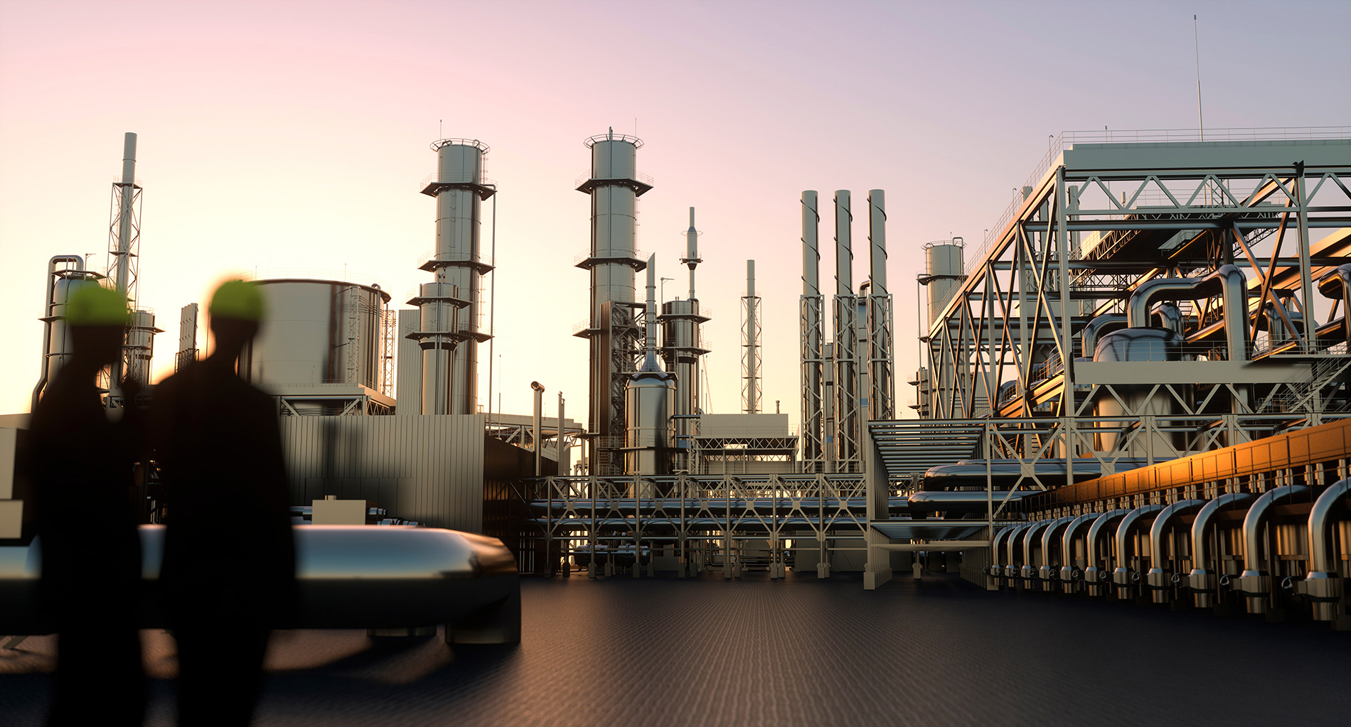 Two people in safety helmets stand in front of a large, modern Oil & Gas industrial plant with tall towers, pipes, and metal structures at sunset.